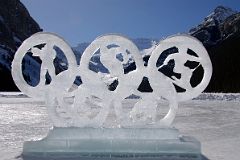24A Olympic Rings Ice Sculpture On Frozen Lake Louise With Mount Victoria and Mount Whyte Behind.jpg